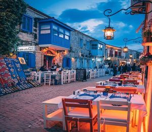 View of restaurant and buildings at dusk