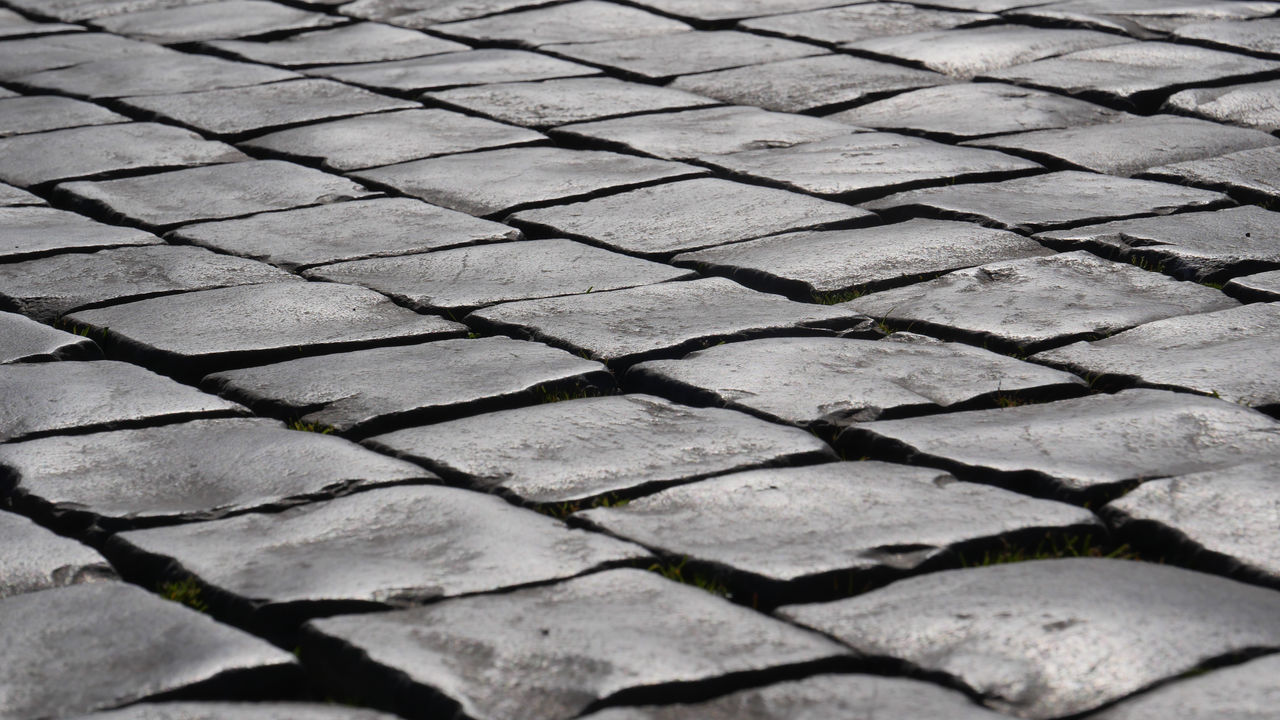 cobblestone, road surface, pattern, asphalt, backgrounds, full frame, footpath, no people, textured, monochrome, black and white, floor, day, high angle view, flooring, roof, soil, paving stone, street, stone, monochrome photography, outdoor structure, outdoors, repetition, sunlight, in a row, wall, line, close-up, nature, city, shape