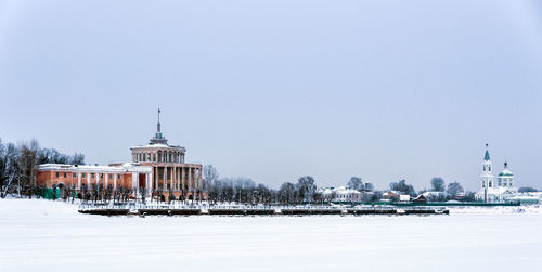 View of buildings against clear sky during winter