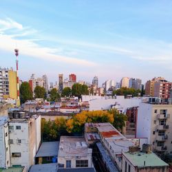 High angle view of buildings in city against sky