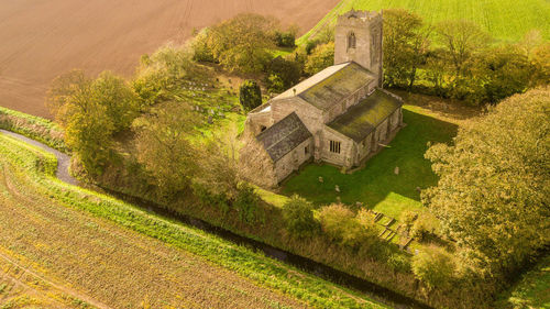 High angle view of cottage on field