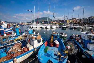 Boats moored at harbor