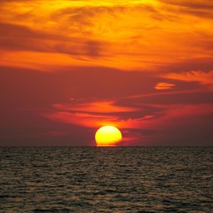 Scenic view of sea at sunset