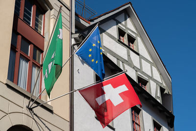 Saint gallen, switzerland march 9, 2022 swiss flag and european flag with the flag of saint gallen