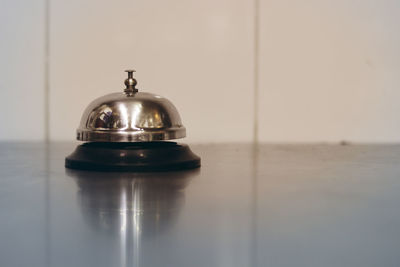 Close-up of service bell on table