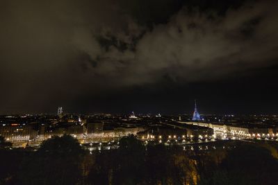 Illuminated buildings in city at night