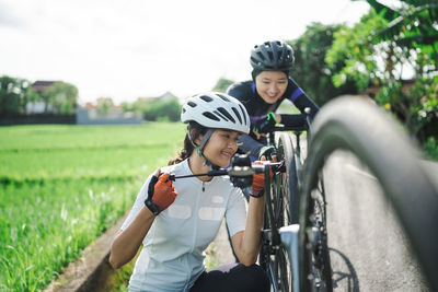 Man riding bicycle on field