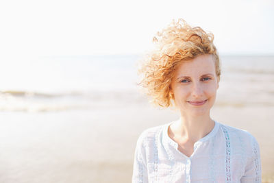 Portrait of young woman on the beach