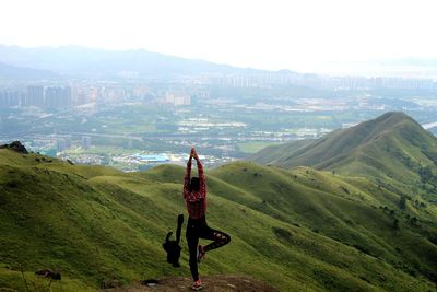 Man on mountain against sky