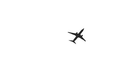 Low angle view of airplane flying in sky