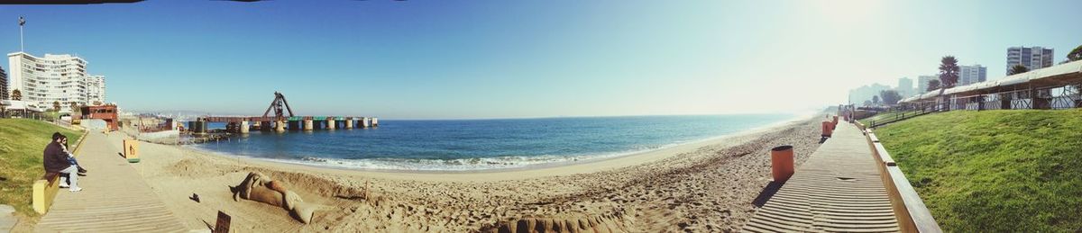 Scenic view of beach against blue sky