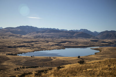 Scenic view of landscape and mountains against sky