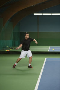 Man playing tennis