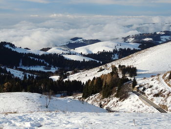 Scenic view of snowcapped mountains against sky