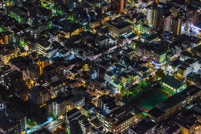 High angle view of illuminated cityscape at night