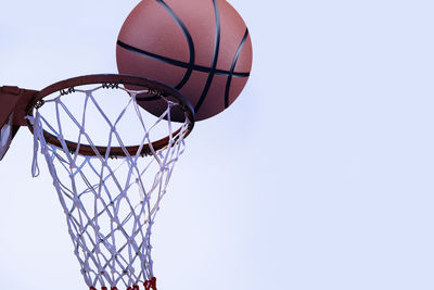 Low angle view of basketball hoop against clear sky