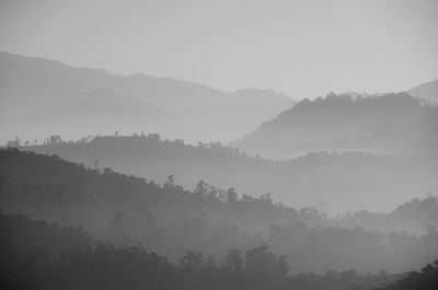 Scenic view of mountains against sky during foggy weather