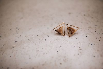 Close-up of earring on table