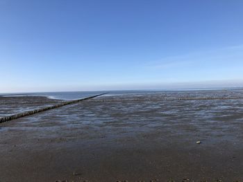 Scenic view of sea against clear blue sky