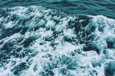 High angle view of water flowing over sea