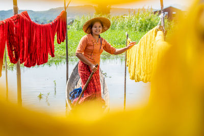 Portrait of a smiling young woman with umbrella