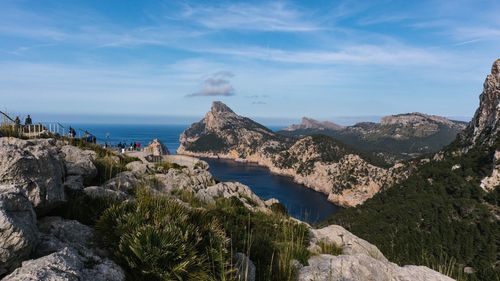 Panoramic view of sea and mountains against sky