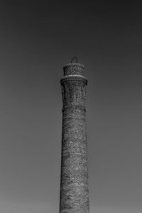 Low angle view of smoke stack against sky