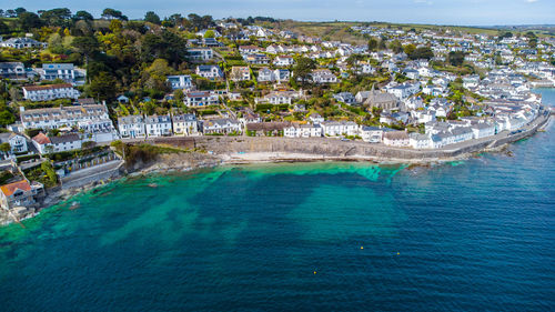 High angle view of buildings by sea