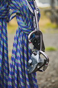 Close up shot of climbing rope and belay device