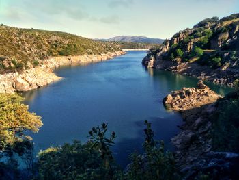 Beautiful scenic view of river against sky