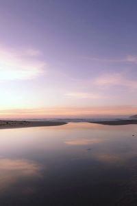 Scenic view of sea against sky at sunset