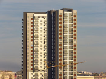 Low angle view of buildings against sky during sunset