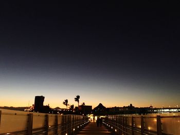 Illuminated bridge at night