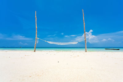 Scenic view of beach against blue sky