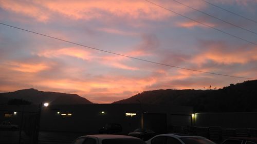 Scenic view of mountains against sky at sunset