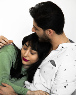 Close-up of mother and daughter at home