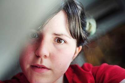 Close-up portrait of woman at home