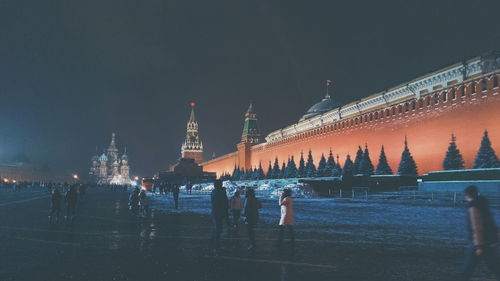 People at red square against sky
