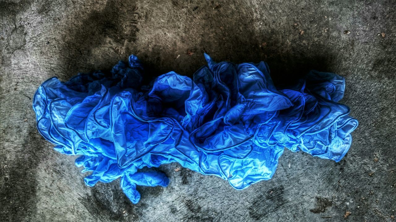 blue, high angle view, purple, close-up, directly above, flower, no people, day, outdoors, fragility, petal, still life, nature, textured, creativity, wet, art and craft, plant, sunlight, leaf