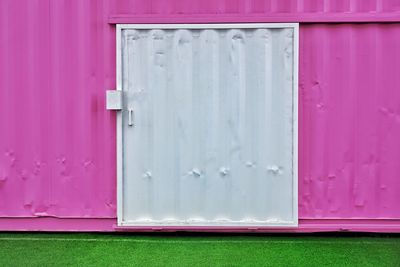 Close-up view of pink door