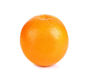 Close-up of orange apple against white background