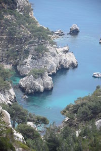 High angle view of rocks in sea