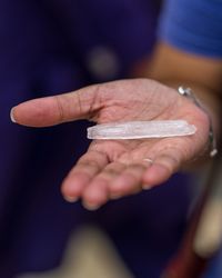 Close-up of hand holding ice cream