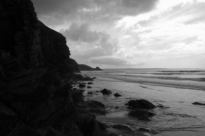 Scenic view of sea against cloudy sky