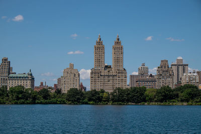 Buildings in city against sky