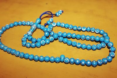 Close-up of necklace on table