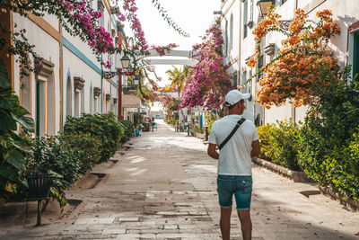 Rear view of man standing on street