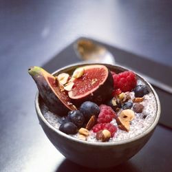 Close-up of fresh fruits in bowl on table