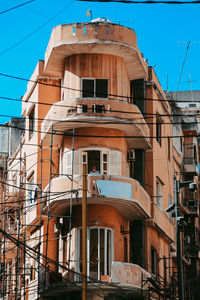 Low angle view of old building against blue sky