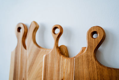 Close-up of cutting boards against white background